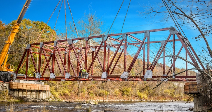 Optimal Design Of Through-Truss Steel Bridges